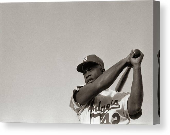 Jackie Robinson in Brooklyn Dodgers uniform, swinging bat Canvas