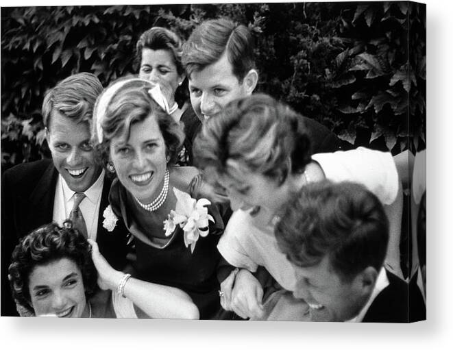 President Kennedy Canvas Print featuring the photograph Kennedy Family Embracing John and Jackie At Wedding - 1953 by War Is Hell Store