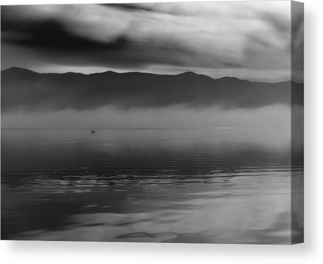 Lake Canvas Print featuring the photograph Lonely flight by Ioannis Konstas