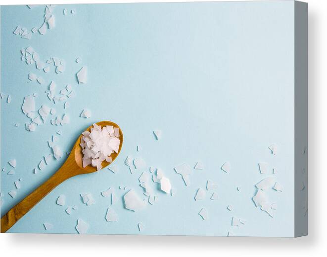 Spoon Canvas Print featuring the photograph Magnesium vitamin flakes on wooden spoon. by Helin Loik-Tomson