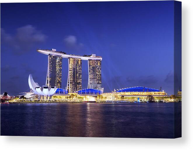 Blue Hour Canvas Print featuring the photograph Marina Bay Sands Light & Water Show by Bernd Schunack