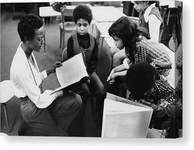 Model Canvas Print featuring the photograph Model Naomi Sims Reading Her Children's Story by Berry Berenson