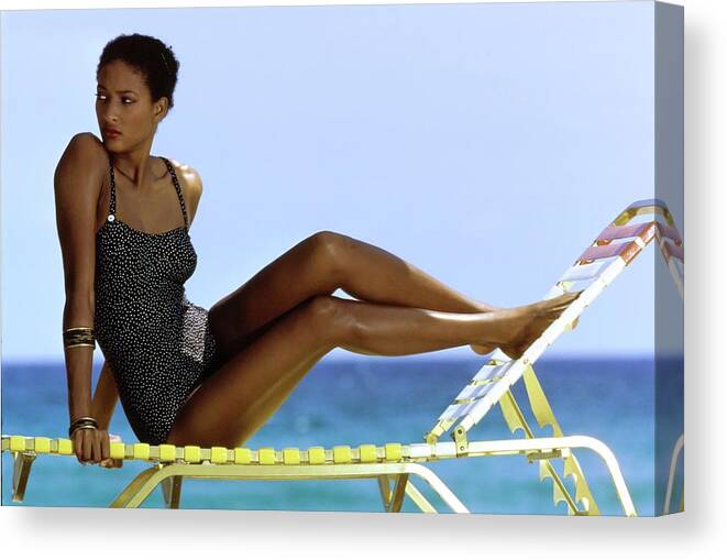 Fashion Canvas Print featuring the photograph Peggy Dillard in a Polkadot Swimsuit by Guy le Baube