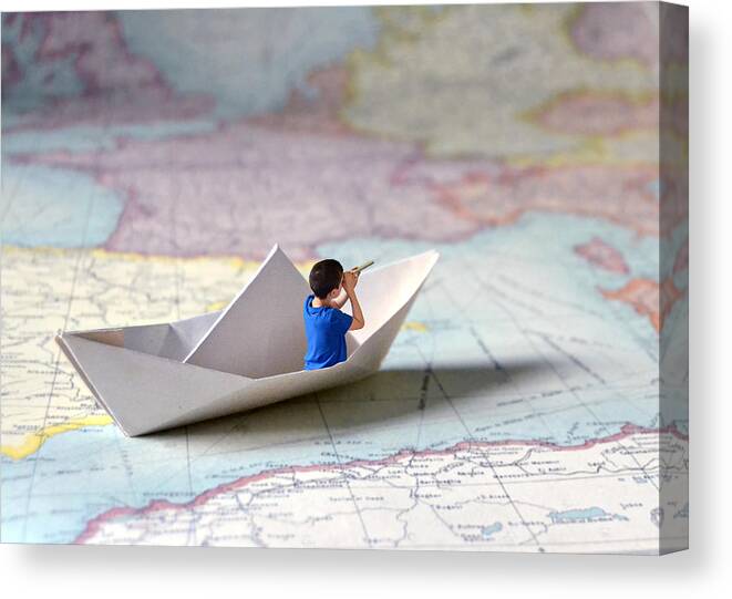 Child Canvas Print featuring the photograph Sailing in a paper ship by Natalia Crespo