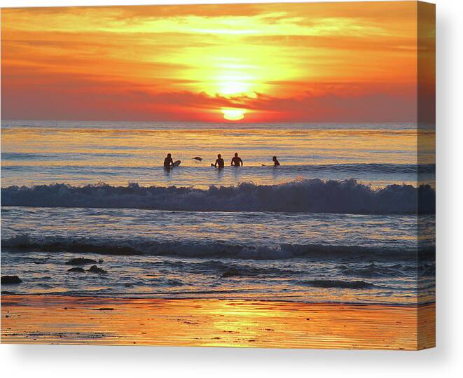 Surfer Canvas Print featuring the photograph Waiting for the last wave by Joy Buckels