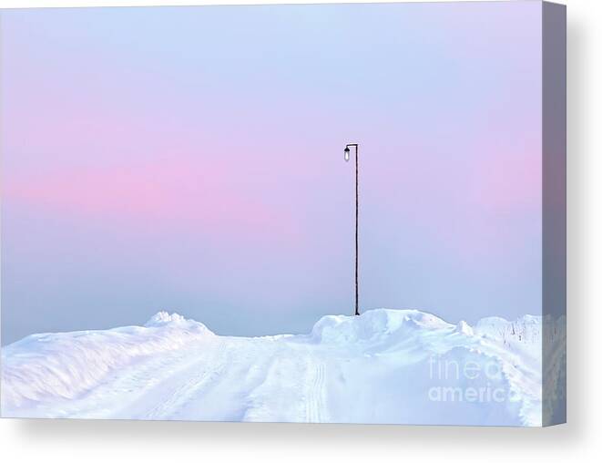 Winter Sunset Pastel Shades Russia Snow Snowdrift Road Pink Post Snowdrifts Blue Sky Impression Impressionistic Conceptual Expressive Creative Contemporary Atmospheric Minimalistic Minimalist Dusk Calm Serene Tranquil Tranquillity Charming Aesthetic Artistic Stylish Style Single Lonely Loneliness Alone Solo Solitary Beautiful Stunning Magnificent Landscape Mindfulness Serenity Inspirational Magic Poetic Singular Powerful Delightful Appealing Simplicity Delicate Gentle Evocative Simple Watercolor Canvas Print featuring the photograph Winter sunset in pastel shades A lamp post on snowy road with sunset reflections on snow by Tatiana Bogracheva