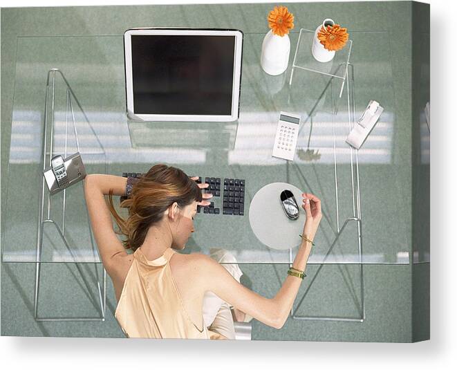 Corporate Business Canvas Print featuring the photograph Woman leaning head on desk with futuristic devices, high angle view by Coco Marlet