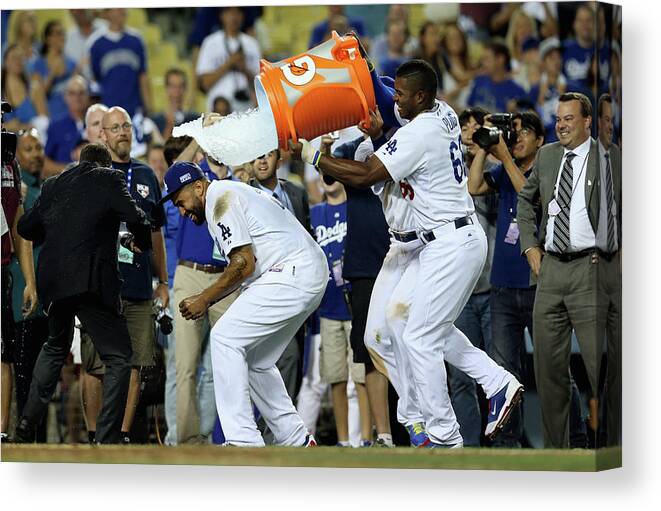Game Two Canvas Print featuring the photograph Yasiel Puig and Matt Kemp by Stephen Dunn
