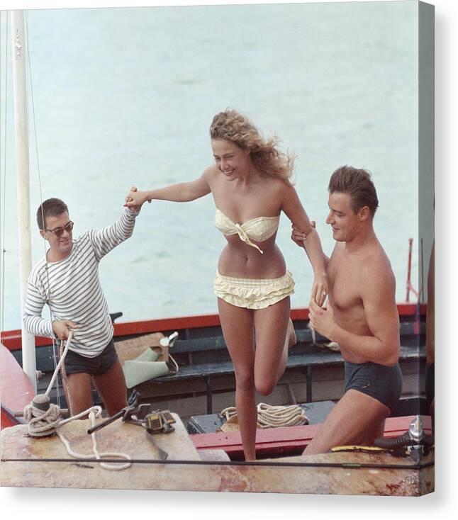 1957 Canvas Print featuring the photograph A Helping Hand by Slim Aarons