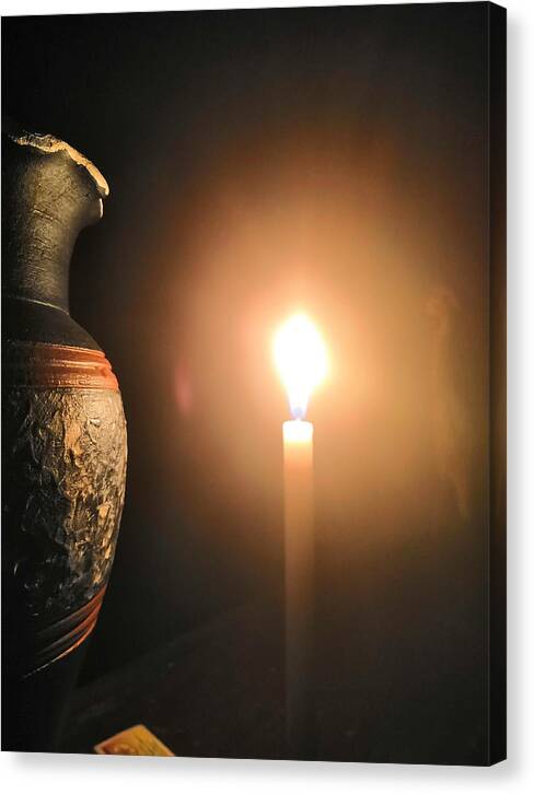 Candle Light Canvas Print featuring the photograph Light in the dark by Ian Batanda