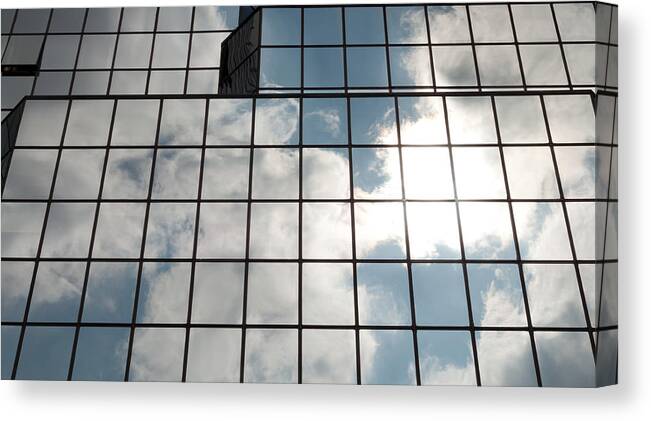 Downtown District Canvas Print featuring the photograph Windows Of Glass Building by Moniaphoto