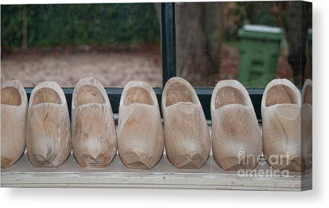 Amsterdam Canvas Print featuring the digital art Rows Of Wooden Shoes by Carol Ailles