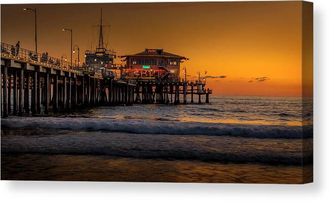 Santa Monica Pier Sunset Canvas Print featuring the photograph Daylight Turns Golden On The Pier by Gene Parks
