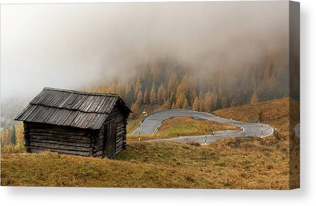 Passo Gardena Canvas Print featuring the photograph Autumn landscape with wooden chalet dolomiti Italian Apls by Michalakis Ppalis