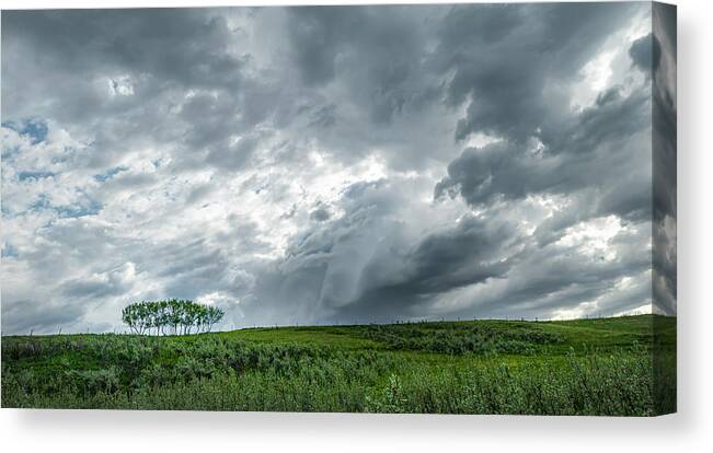 Storm Canvas Print featuring the photograph Storm Over A Green Field by Phil And Karen Rispin