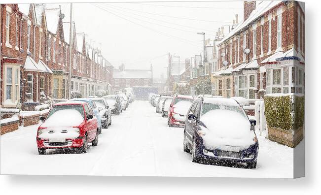 Problems Canvas Print featuring the photograph Typical UK street in winter snow by ChrisHepburn