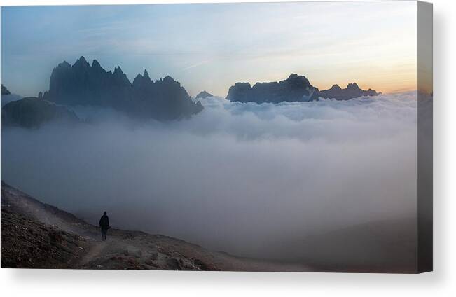 Italian Alps Canvas Print featuring the photograph Unrecognized man trekking at the hiking path at Tre Cime in South Tyrol in Italy. by Michalakis Ppalis