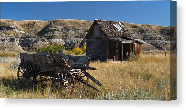 Wagon Canvas Print featuring the photograph Cabin and Wagon Alberta by David Kleinsasser