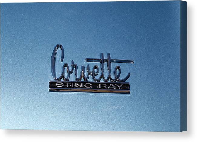 Emblem Canvas Print featuring the photograph Corvette Sting Ray by Morris McClung