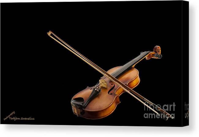Fiddle And Bow Canvas Print featuring the photograph Fiddle and Bow by Torbjorn Swenelius