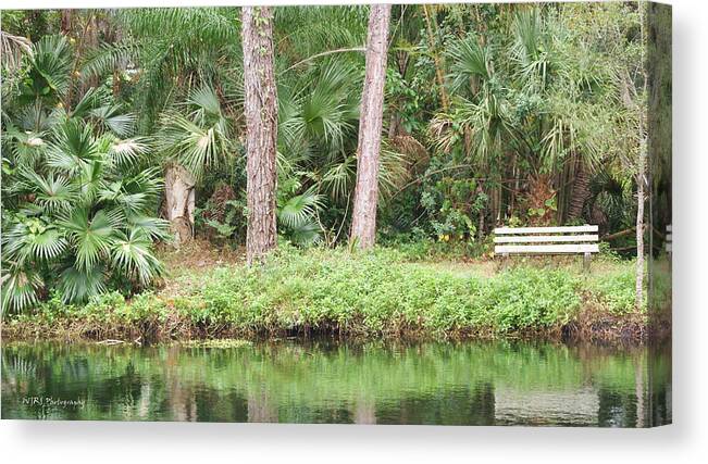 Lake Canvas Print featuring the photograph Lakefront Bench by Walter Rickard