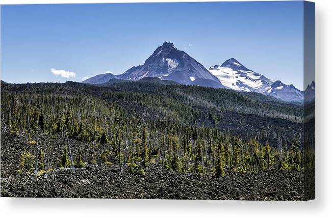 Lava Field Canvas Print featuring the photograph North and Middle Sister and the Lava Fields by Belinda Greb