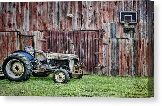 Tractor Canvas Print featuring the photograph Old but Not Done by Heather Applegate