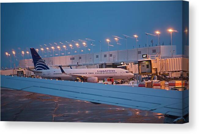 Aircraft Canvas Print featuring the photograph Passenger Airliner At Terminal by Jim West
