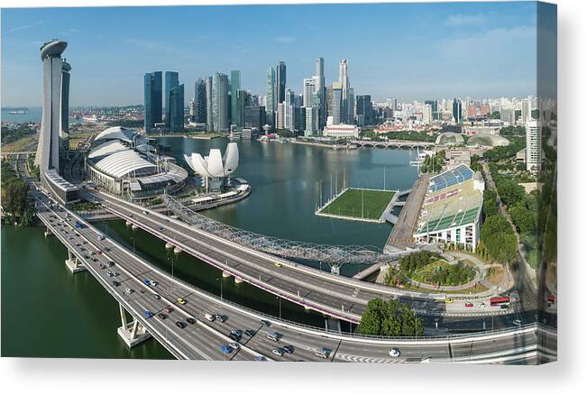 Water's Edge Canvas Print featuring the photograph Singapore Marina Bay Cbd Landmarks by Fotovoyager