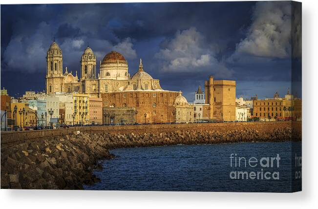 Andalucia Canvas Print featuring the photograph Stormy Skies Over the Cathedral Cadiz spain by Pablo Avanzini