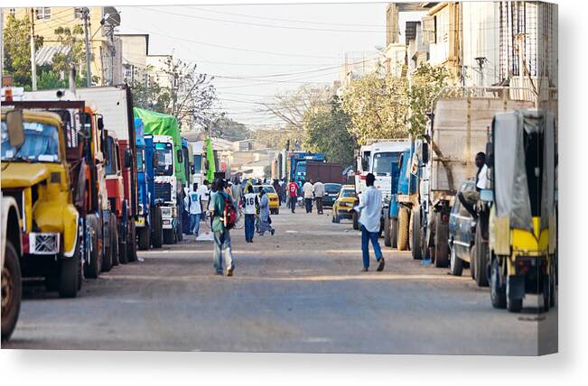 Crowd Canvas Print featuring the photograph Streets of african town. by Peeterv
