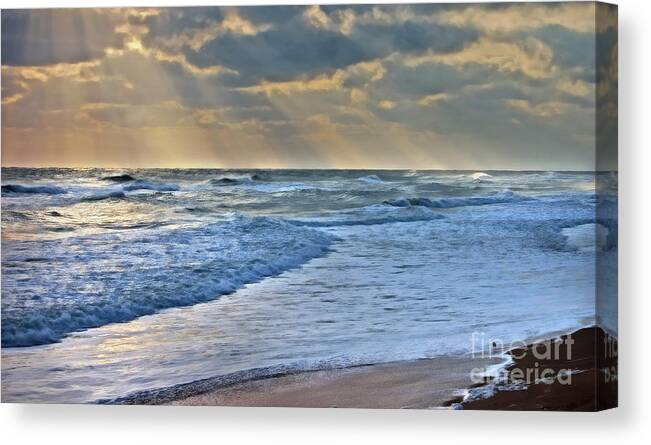 Atlantic Canvas Print featuring the photograph Sunrays on an angry sea by Ules Barnwell