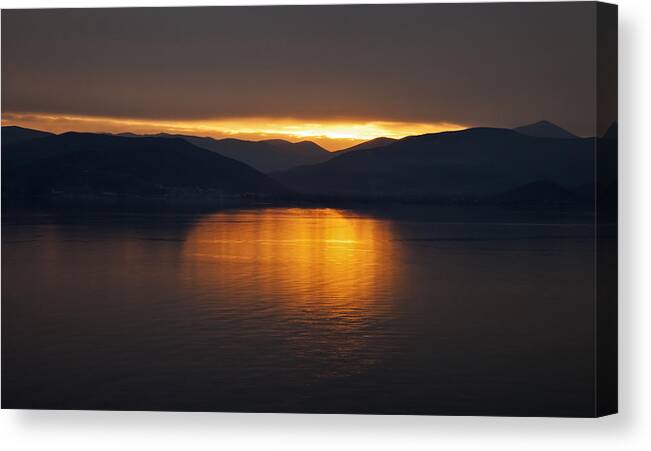 Romantic Canvas Print featuring the photograph Sunset over mountains and sea by Mike Santis