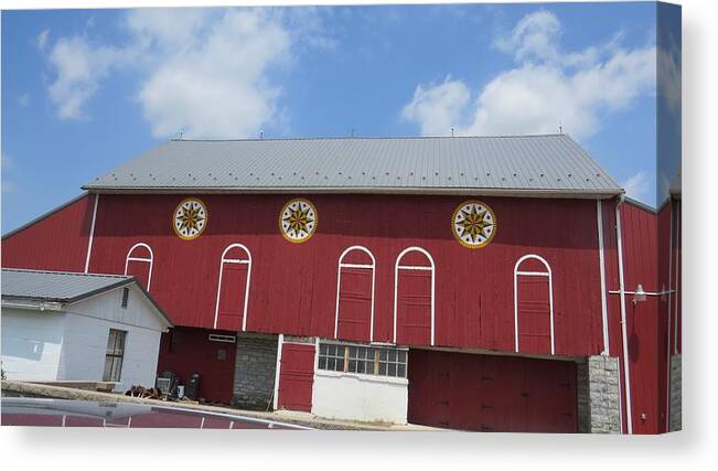 Red Barn Canvas Print featuring the photograph Barn with Hex Signs by Jeanette Oberholtzer