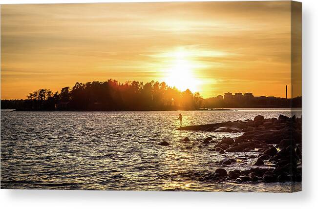 Candid Canvas Print featuring the photograph Fishing at sunset - Helsinki, Finland - Color street photography by Giuseppe Milo