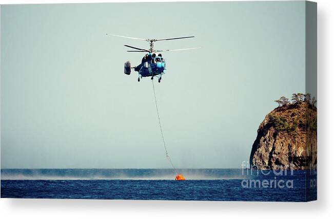 Aerospace Canvas Print featuring the photograph Helicopter firefighter take water in the sea by Raimond Klavins