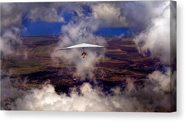 Hang Gliding Canvas Print featuring the photograph Soaring Through The Clouds by Susan Rissi Tregoning
