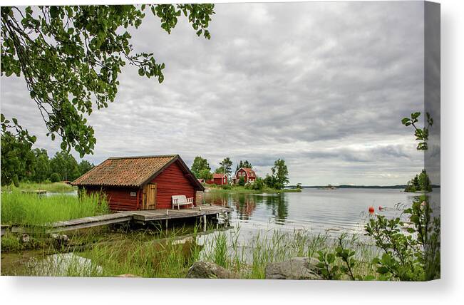 The Old Boat-house Canvas Print featuring the photograph The old boat-house by Torbjorn Swenelius