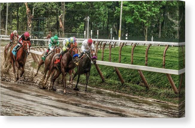 Race Horses Canvas Print featuring the photograph Turning the Mud by Jeffrey PERKINS