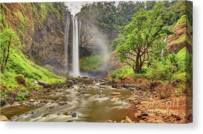Waterfall Canvas Print featuring the photograph Beautiful waterfall hidden in the tropical jungles panorama view by MotHaiBaPhoto Prints