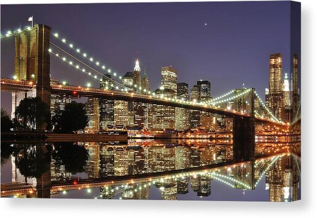 Suspension Bridge Canvas Print featuring the photograph Brooklyn Bridge At Night by Sean Pavone