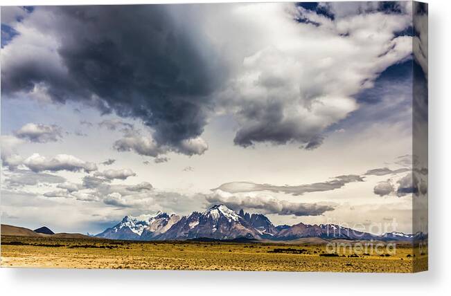 Mountain Canvas Print featuring the photograph Clouds over Torres del Paine National Park, Chile by Lyl Dil Creations