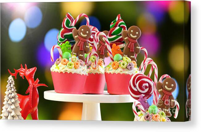 Christmas Canvas Print featuring the photograph On trend candy land festive Christmas cupcakes. by Milleflore Images