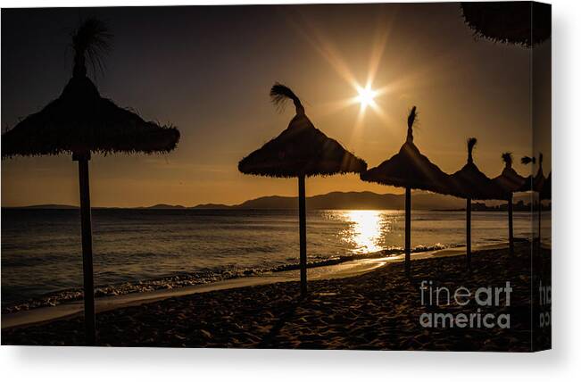 Sunset Canvas Print featuring the photograph Sunset on the beach, Mallorca, Spain by Lyl Dil Creations