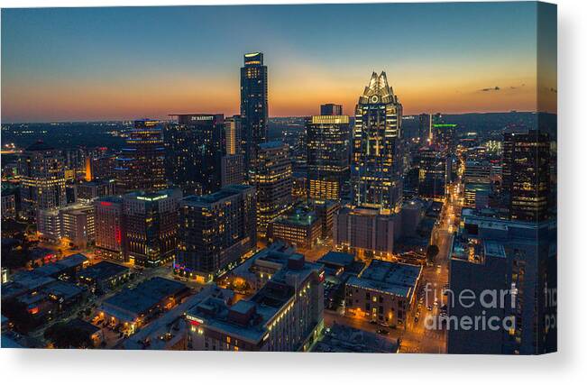 Austin Skyline Canvas Print featuring the photograph The Austin skyline shines at night in this scenic view of the booming downtown growth by Dan Herron
