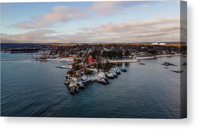 Lighthouse Canvas Print featuring the photograph Marquette Harbor Lighthouse along Lake Superior in Marquette Michigan in the winter #3 by Eldon McGraw