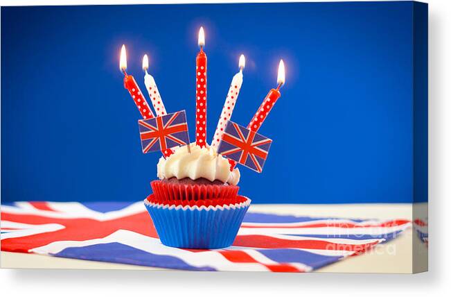 British Canvas Print featuring the photograph Red white and blue theme cupcakes and cake stand with UK Union Jack flags #3 by Milleflore Images