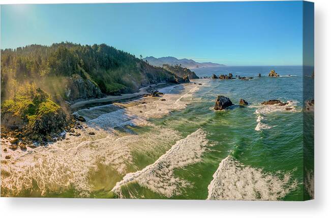 Sunrise Canvas Print featuring the photograph Near sunrise aerial 3-photo pano hovering over the ocean off Ecola Park and Crescent Creek Beach by Chris Anson