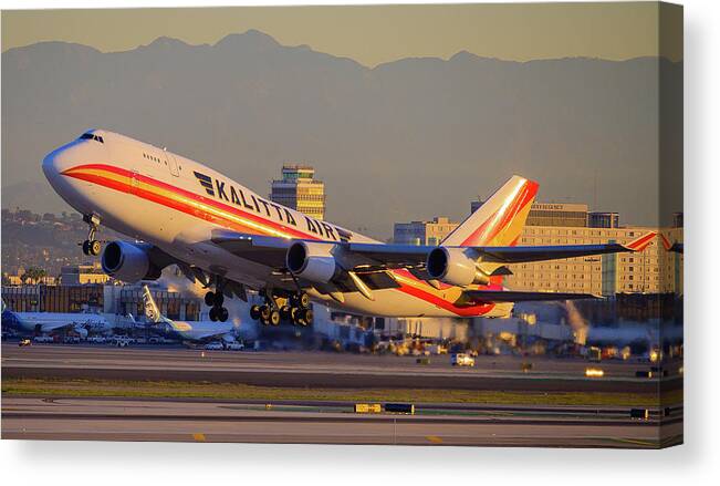 Jet Canvas Print featuring the photograph Dawn 747 Take Off by Douglas Castleman