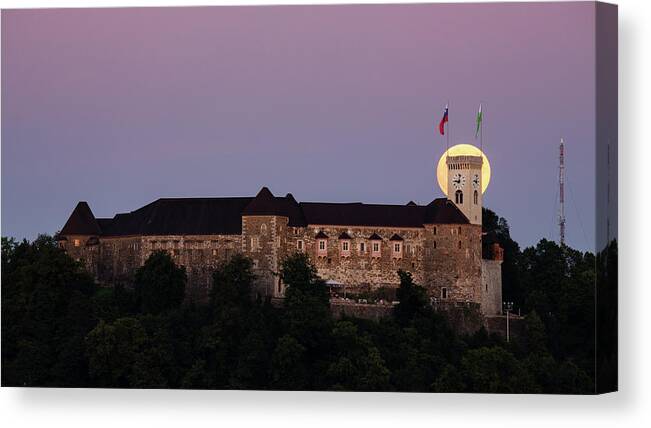 Ljubljana Canvas Print featuring the photograph Full moon behind Ljubljana Castle by Ian Middleton